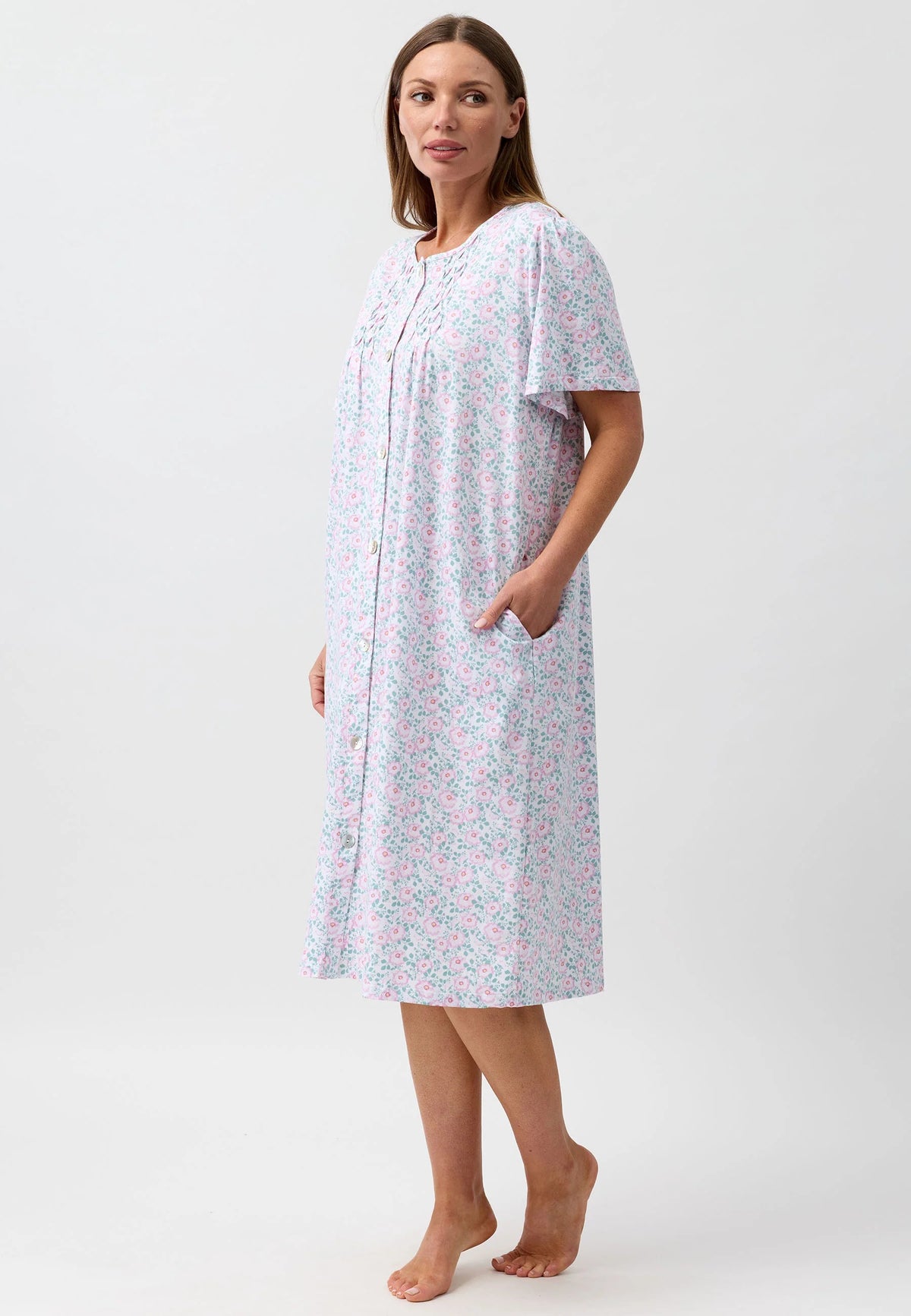 A soft light blue camellia brunch coat nightgown with delicate pink and green floral pattern for comfortable wear