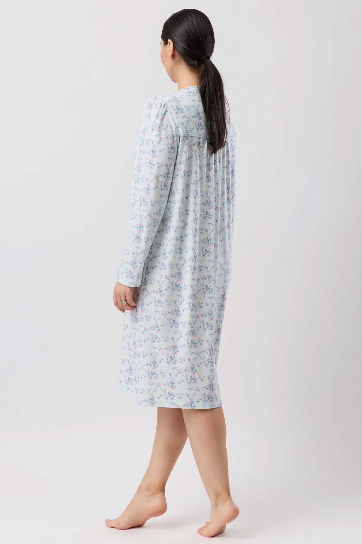 A light blue cherry blossom nightie with a delicate floral pattern and long sleeves perfect for comfortable sleepwear