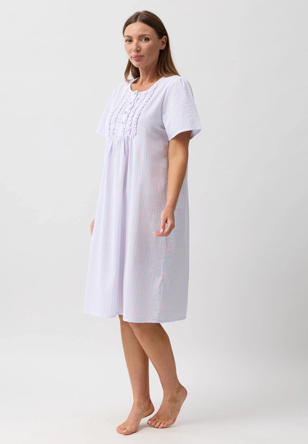 A soft light blue and white striped nightie with delicate embroidery at the neckline for comfortable nightwear