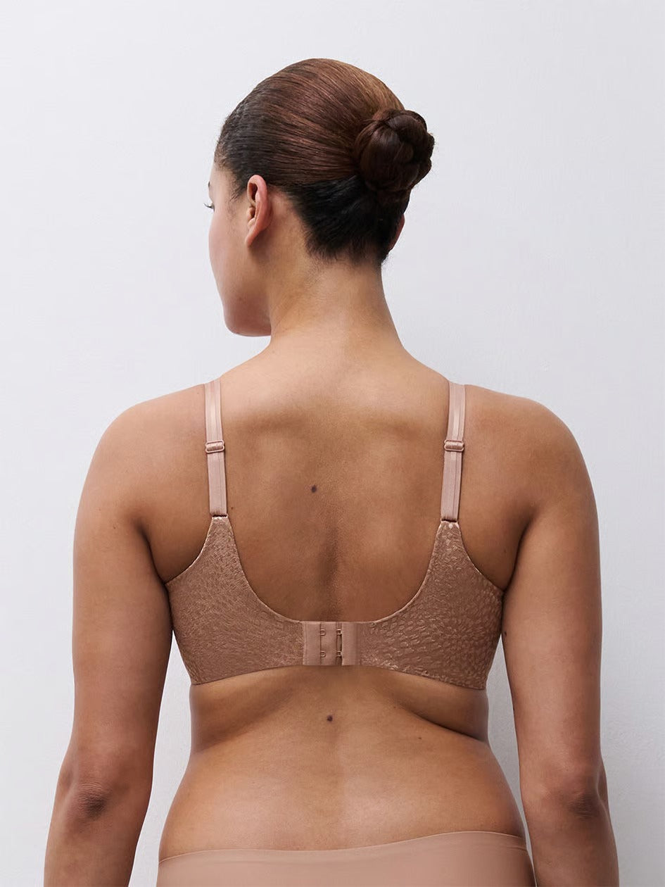 Beige lace underwire magique minimizer bra with adjustable straps and center back closure shown from the back side