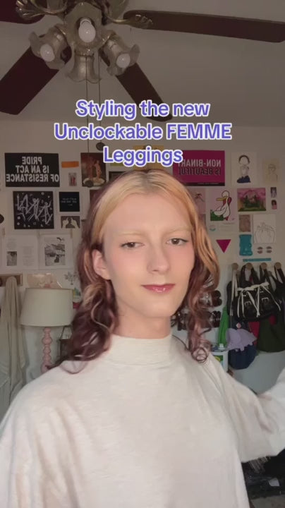 Person showing off the Unclockable Femme Leggings in bedroom