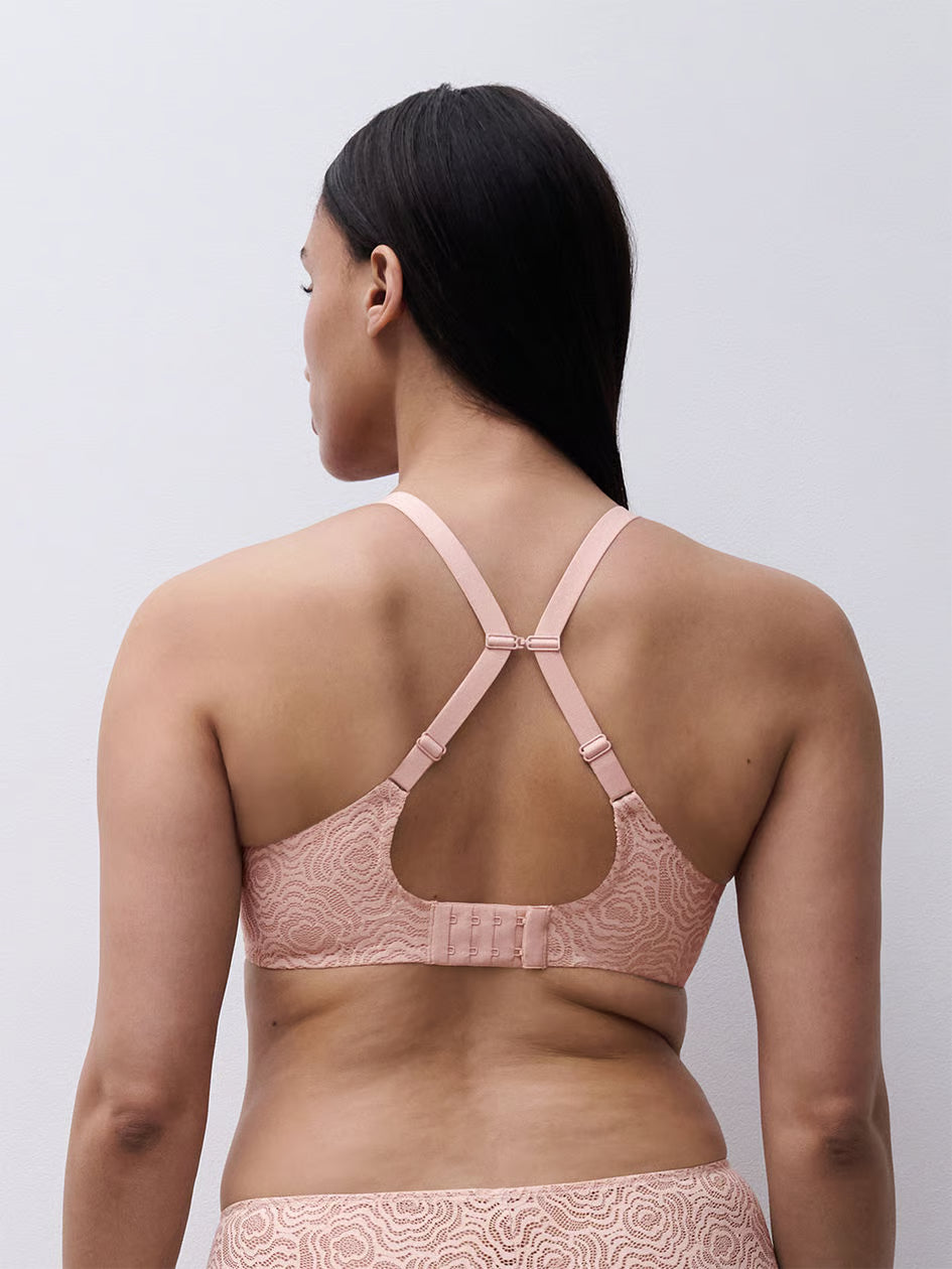 A delicate pink lace C Jolie Comfort convertible t-shirt bra with crisscross back straps and adjustable straps