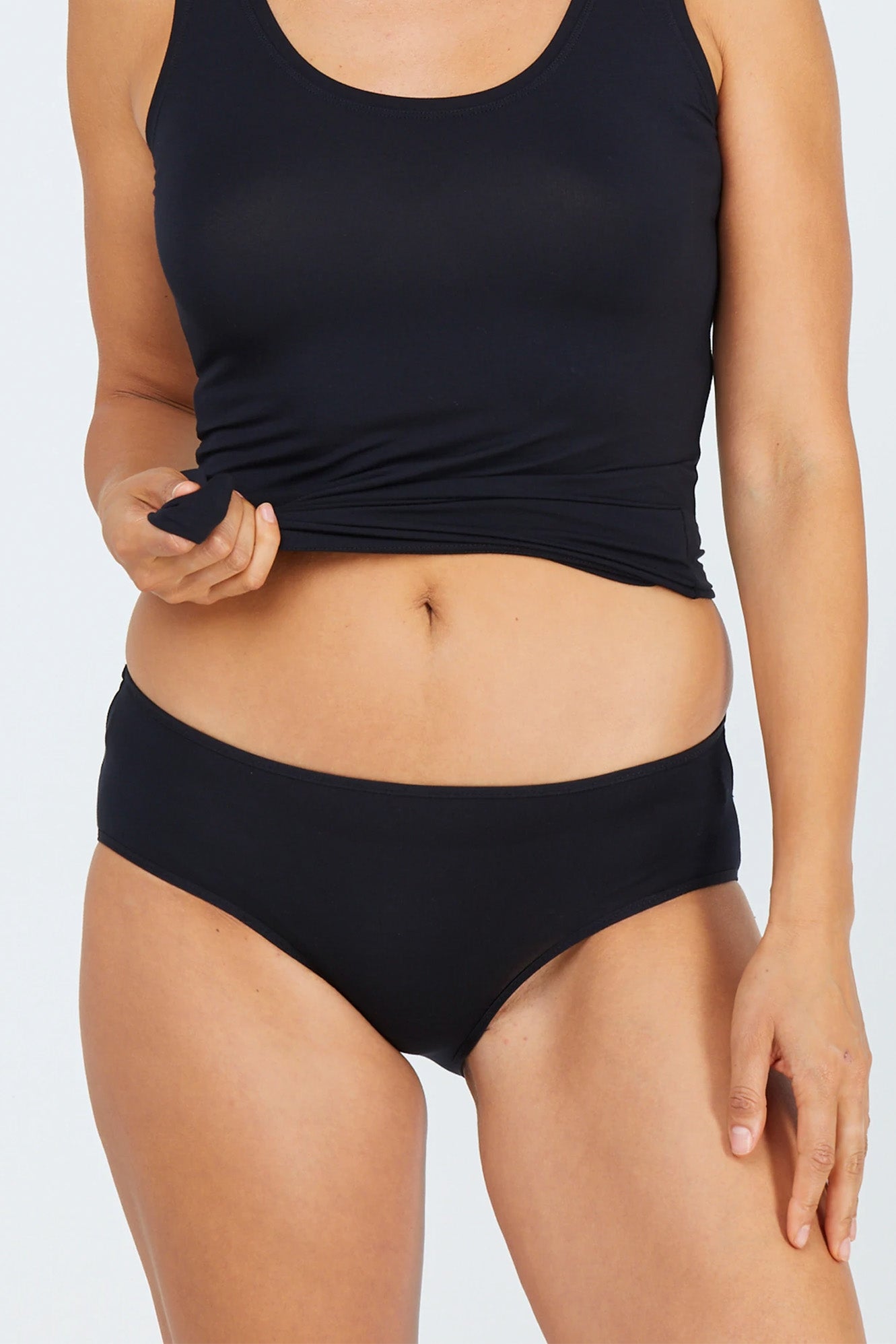 Woman wearing black tani 5984 Hipster Bikini
