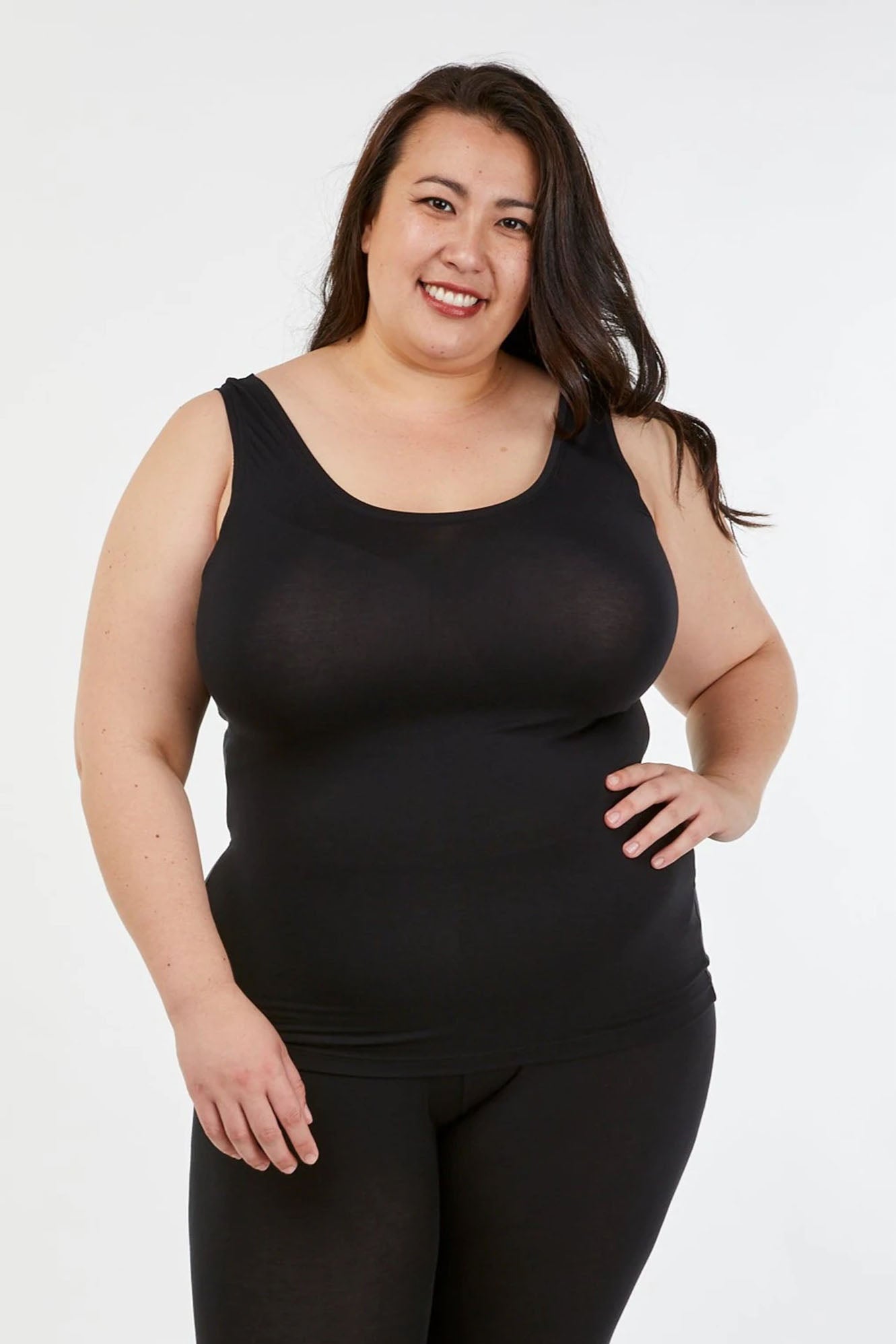 Woman wearing black Tani Scoop Tank 79246