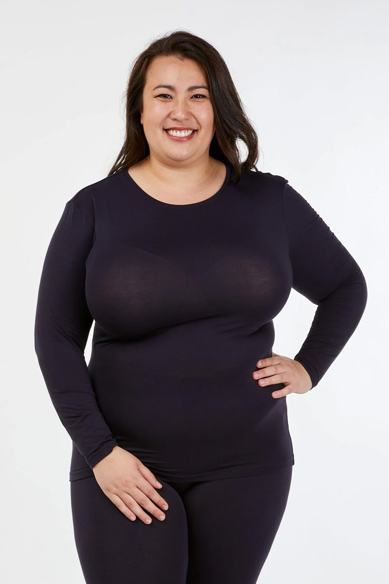 Full figure woman wearing Tani 79276 High Neck Long Sleeve in French Navy full view