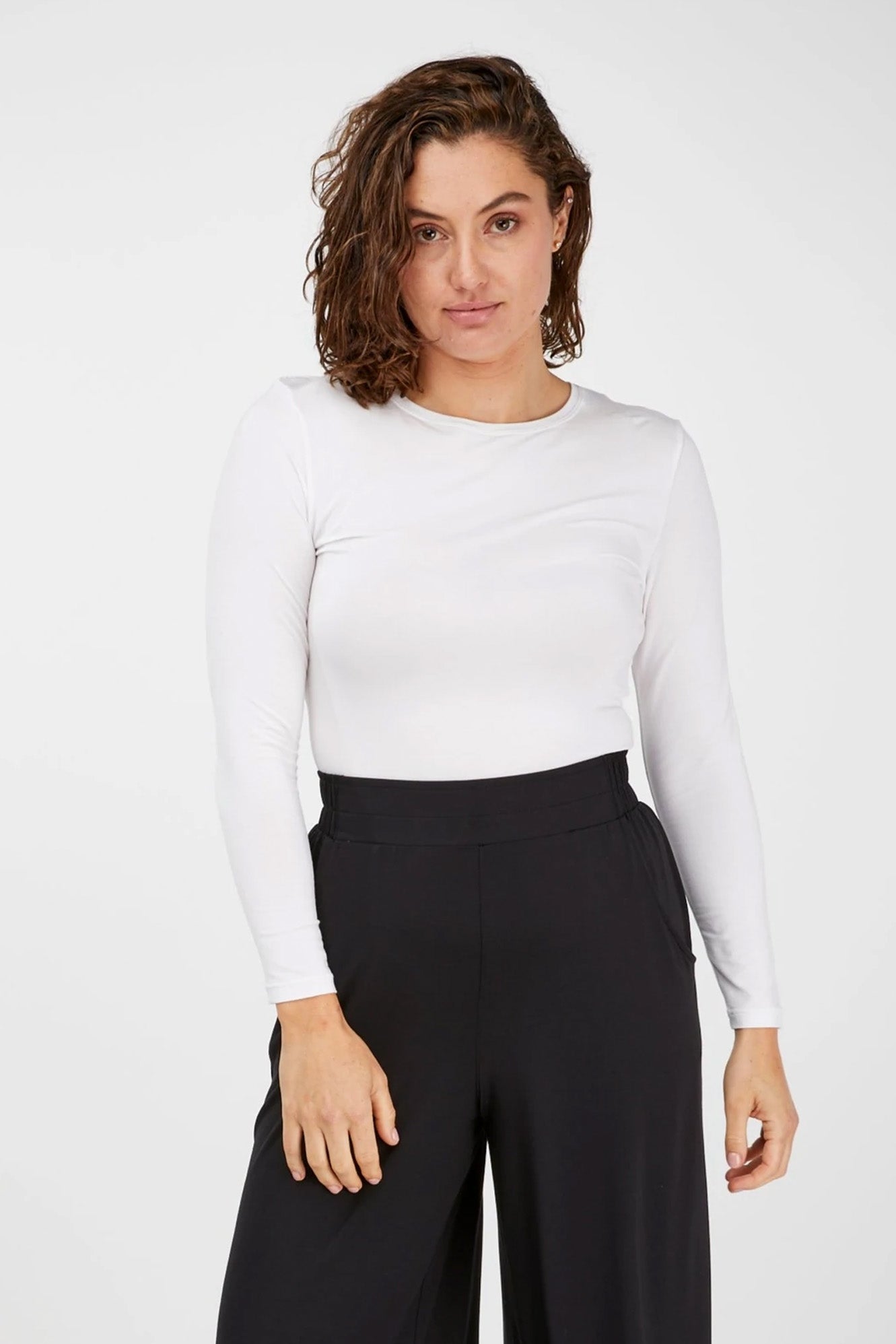 Young woman wearing Tani 79276 High Neck Long Sleeve in White