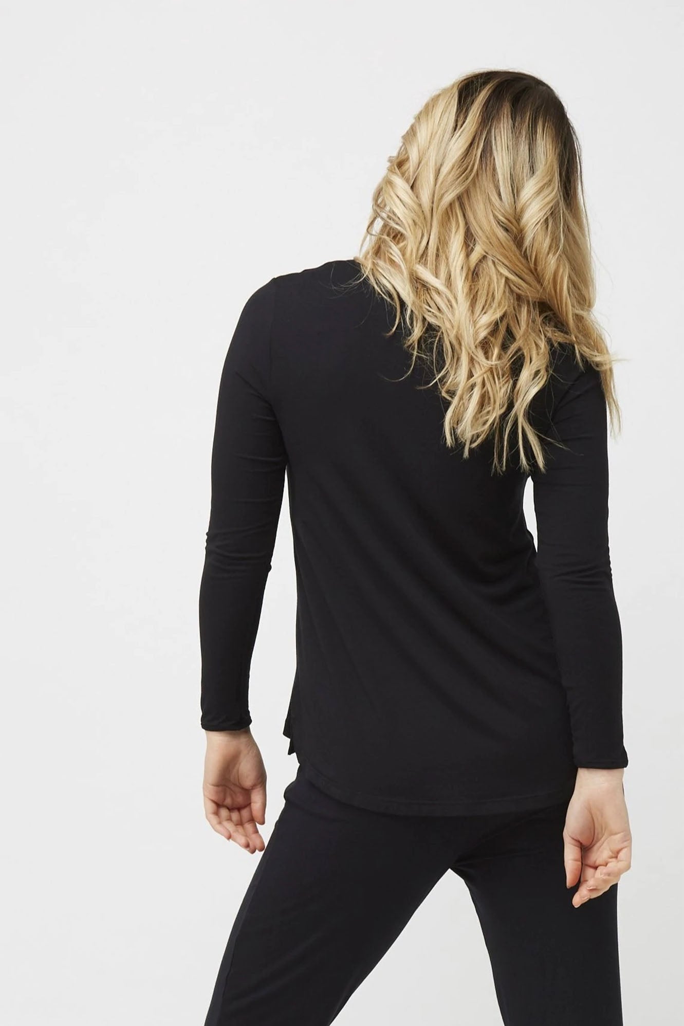Woman wearing Tani Split Hem Relax Top 79410 in black back view