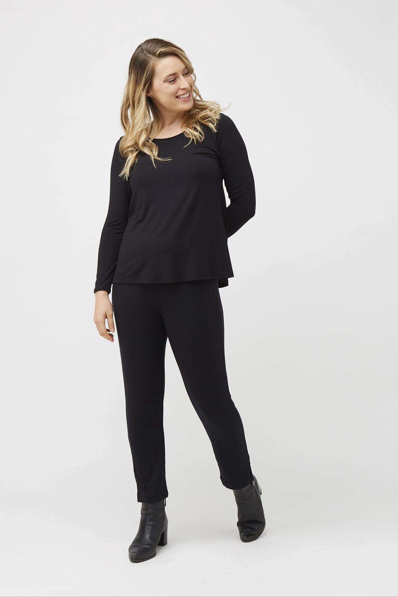 Woman wearing Tani Split Hem Relax Top 79410 in black