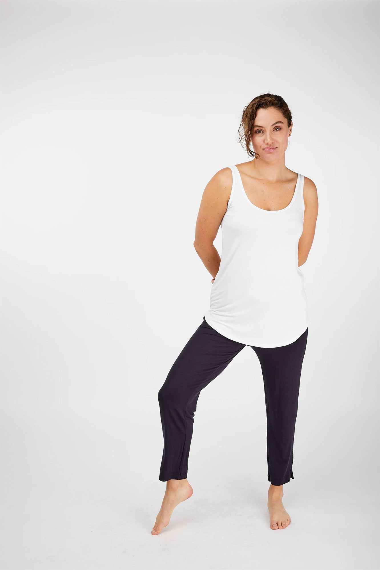 Woman wearing white Tani Tank 79752