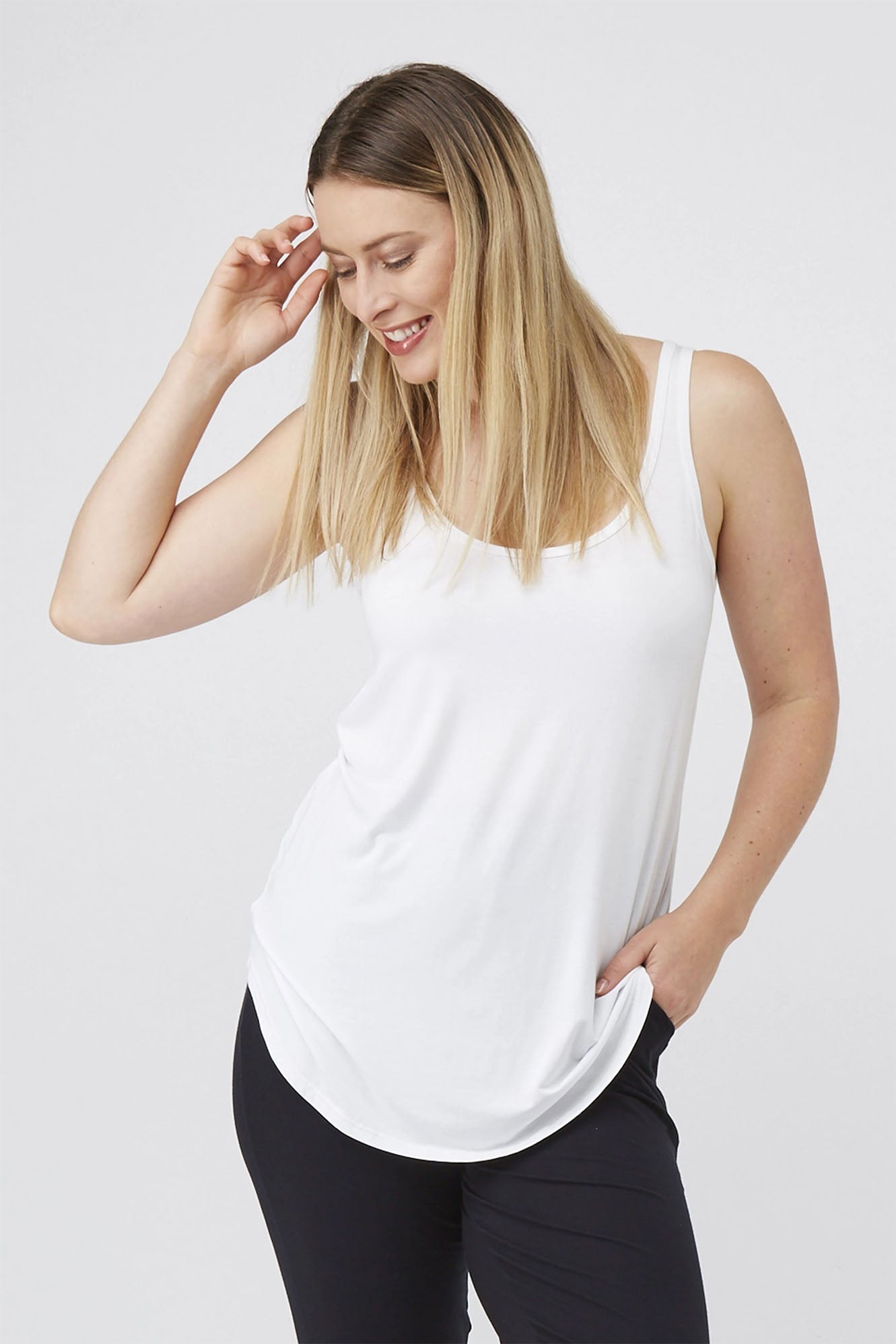 Woman wearing white Tani Tank 79752