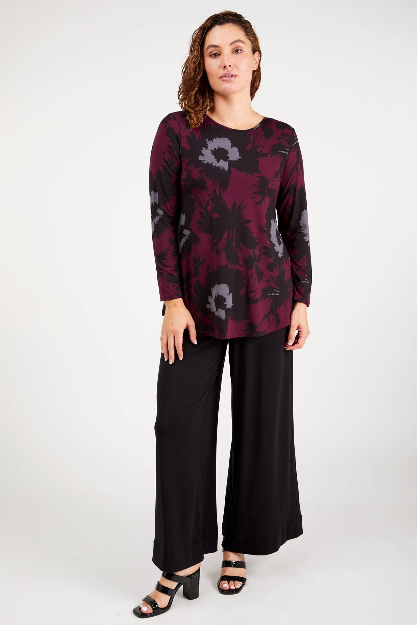 Young woman wearing Tani 79767 Cara Long Sleeve in Bloom Print full view