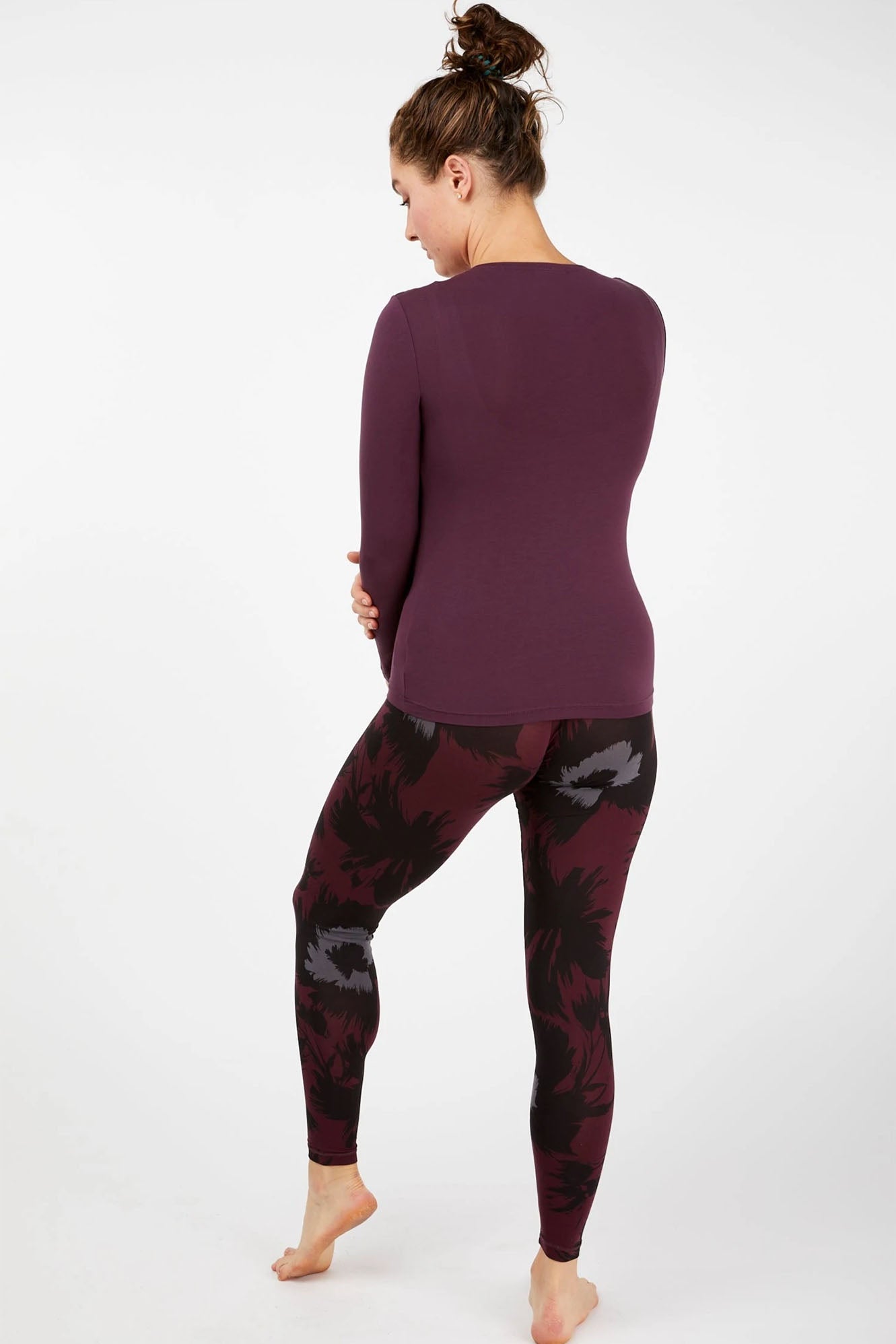 Woman wearing Tani 89118 leggings in Bloom back view