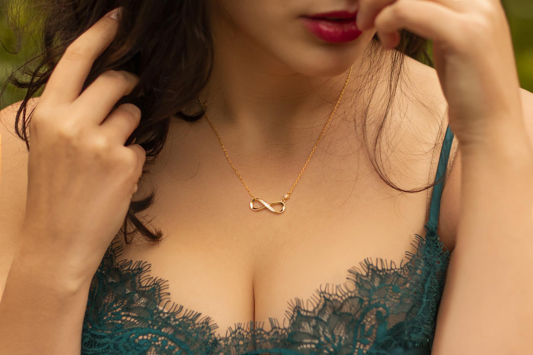 Woman wearing chemise and infinity necklace