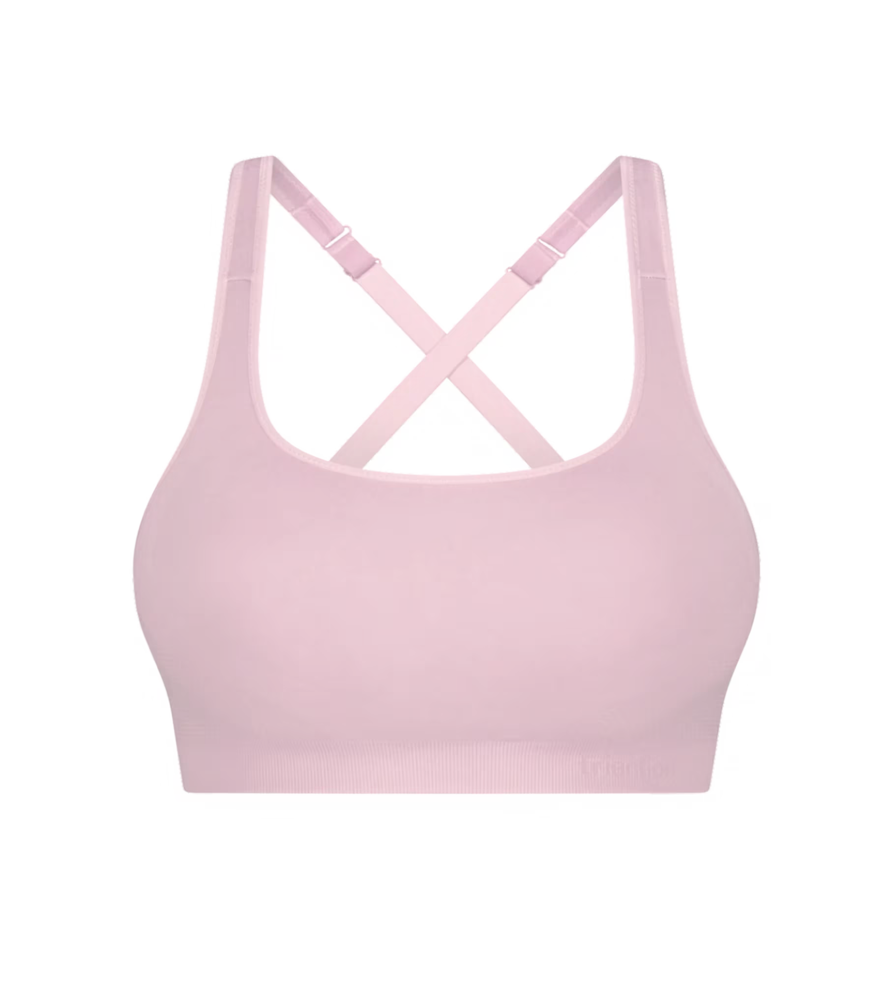 Soft pink triaction ultra seamfree top sports bra with crisscross back straps and ribbed hem shown from the back side