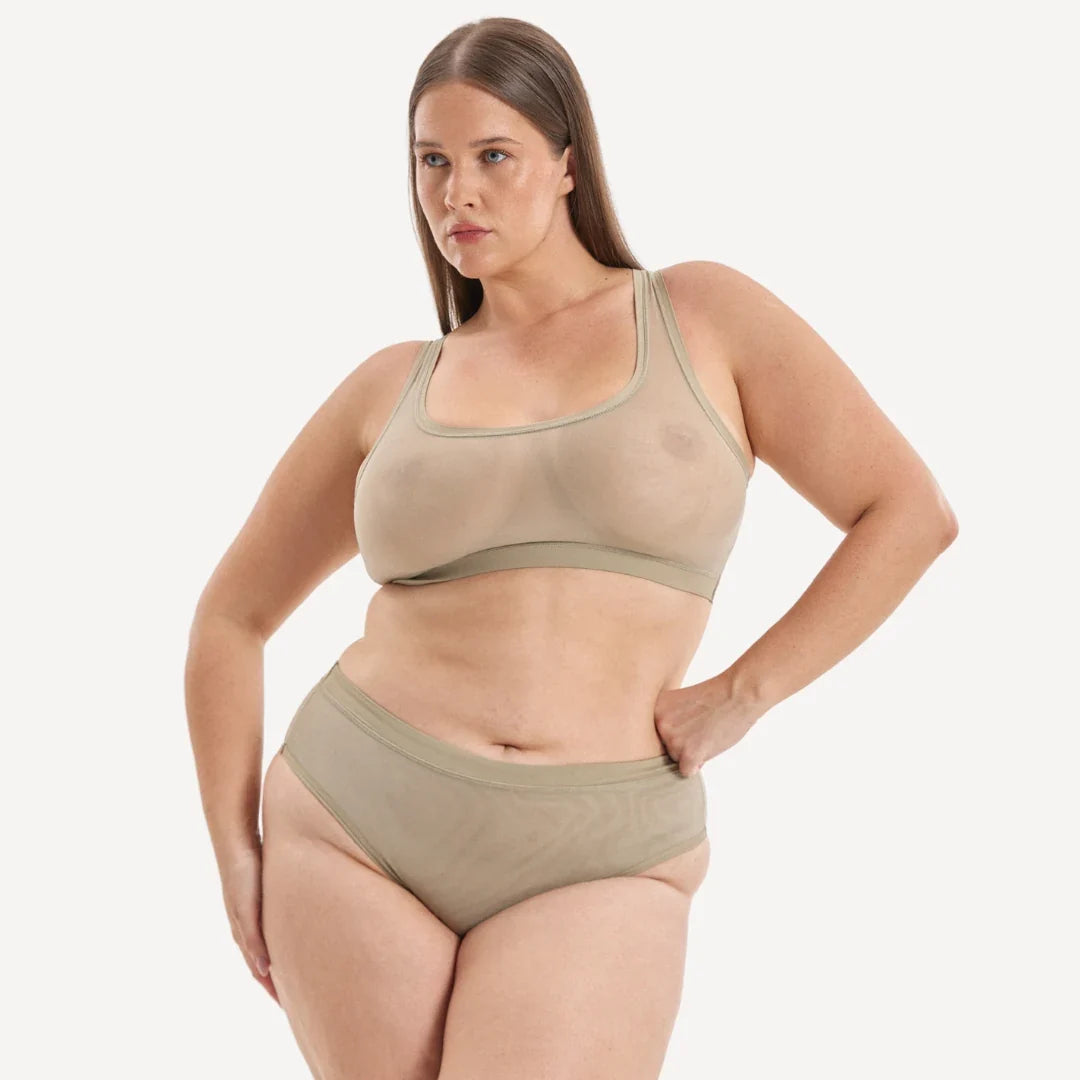 Beige sheer mesh sports bra with solid olive green band and matching high-waisted briefs in everybody tuck brief set