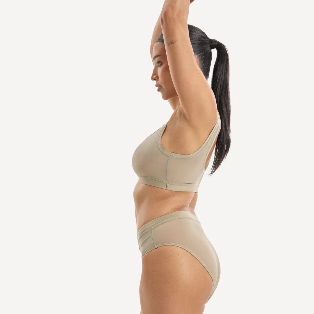 Beige Everybody Tuck Brief athletic two-piece set with supportive bra top and high-waisted briefs in smooth stretch fabric