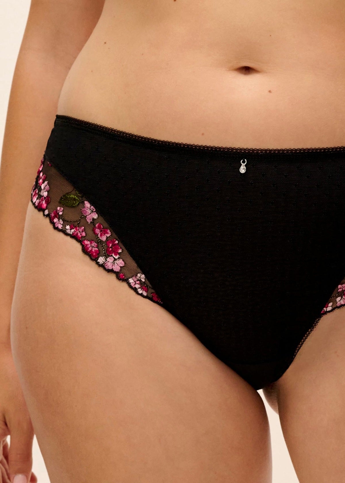Eliyse thong black high-waisted bikini briefs with pink and green floral lace trim along the side