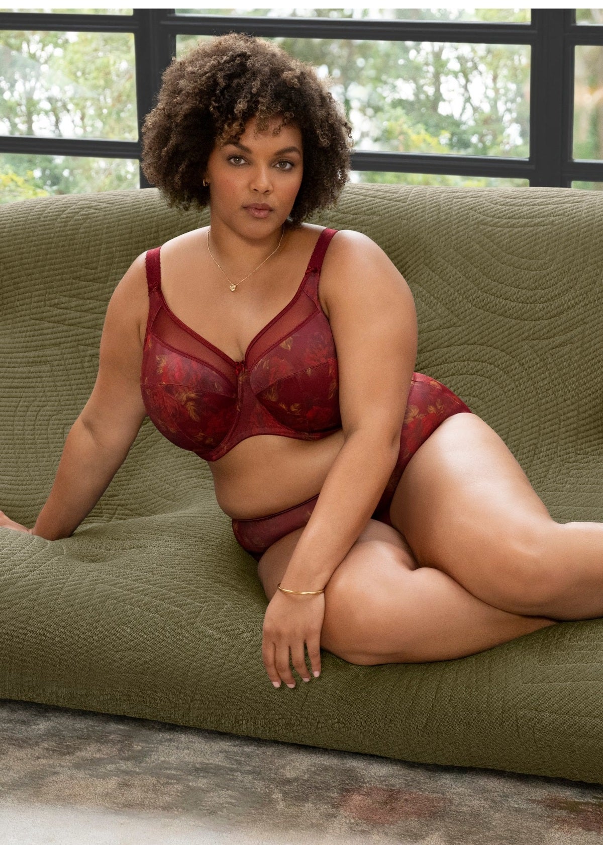 The model is wearing the Kayla red lace bra and matching panties set showcasing delicate lingerie details