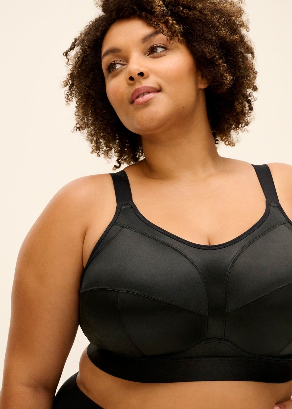 Black Katarina non wired sports bra with seamless construction and adjustable straps for support and comfort