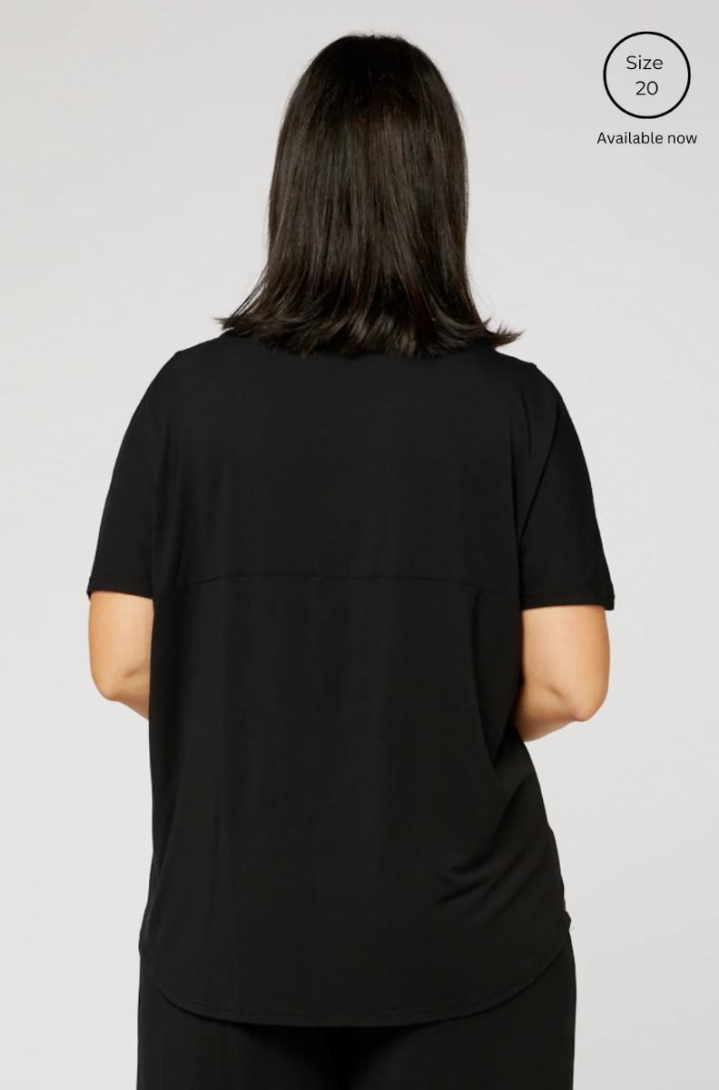 Ivy Swing Tee: black short-sleeved relaxed fit top with subtle horizontal seams