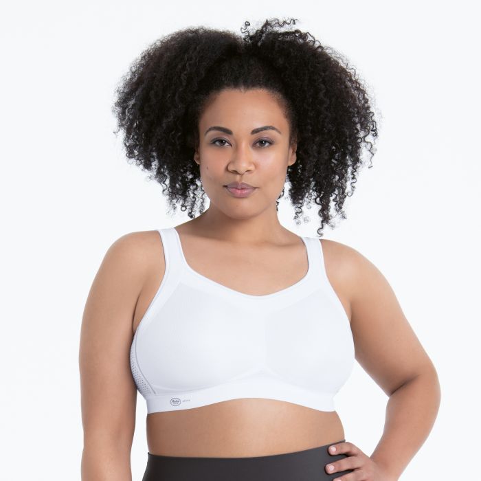 White supportive sports bra momentum with breathable mesh panel detailing for enhanced comfort and performance