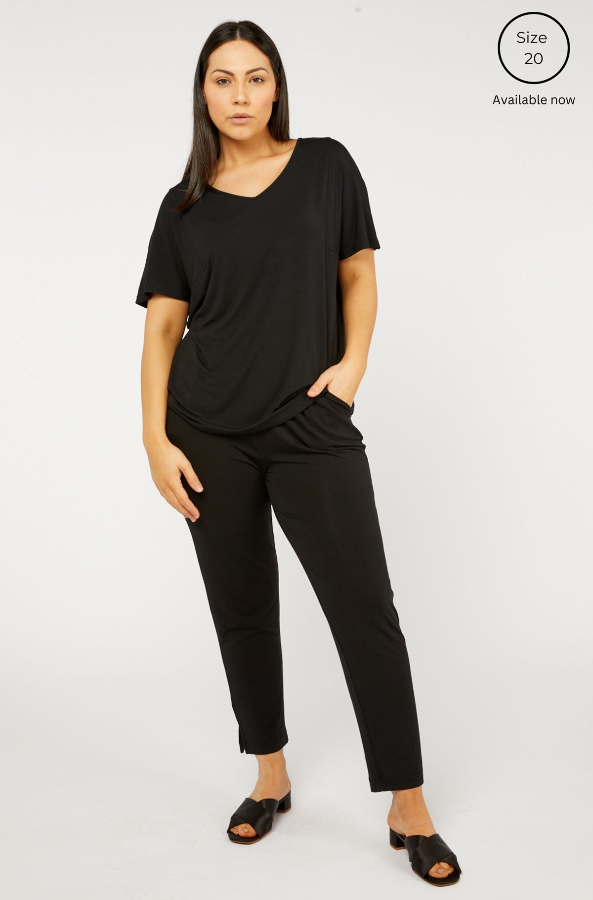 Black ivy swing tee short-sleeved v-neck top with relaxed fit and side pockets for casual wear