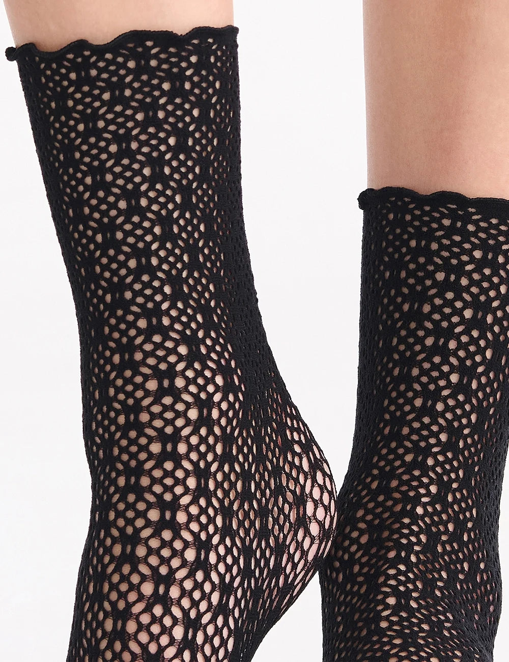 Black lace crochet net anklets featuring scalloped cuff and intricate openwork pattern