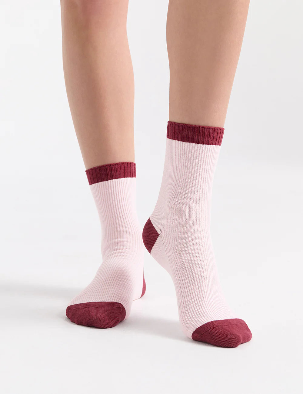 Pink ribbed organic cotton crew socks with burgundy cuffs and toe tips