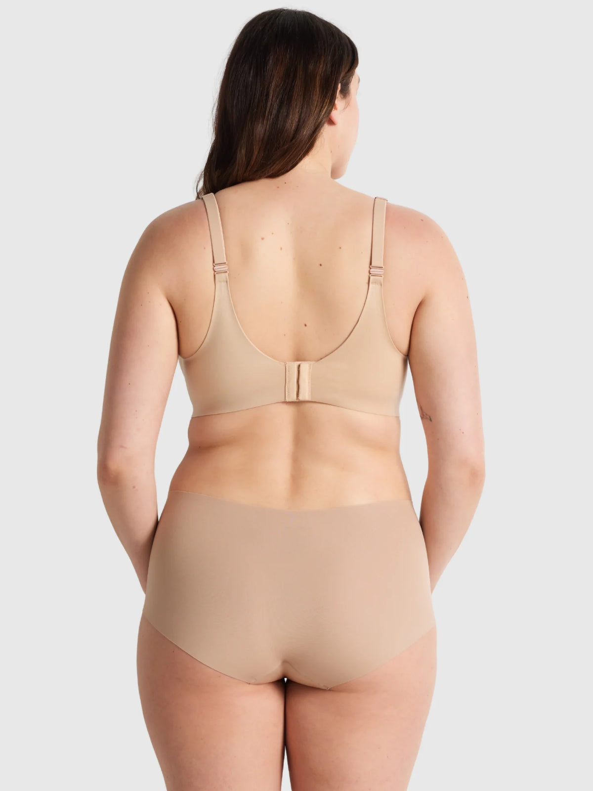 Beige seamless bra and matching high-waisted briefs set designed for comfortable body shaping and support