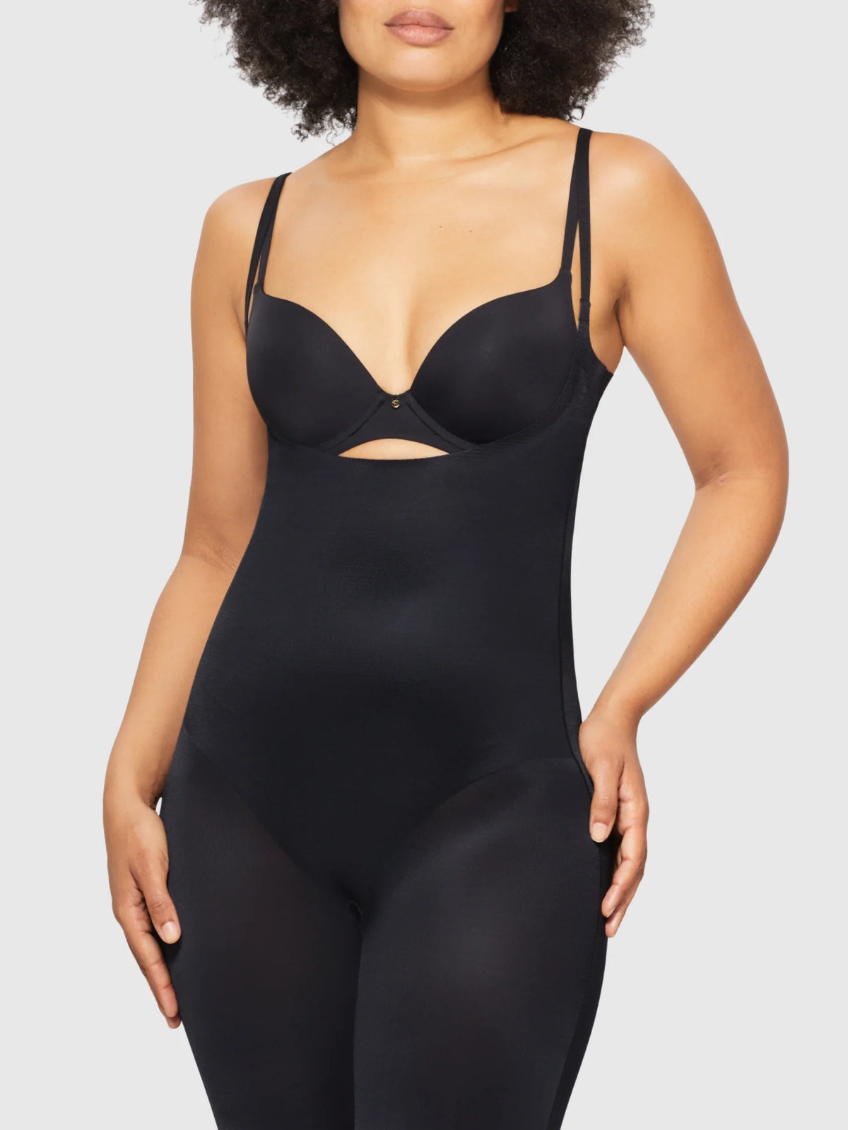 Black seamless Body Skiins underbust jumpsuit bodysuit with thin straps and bust cutout detail for shaping
