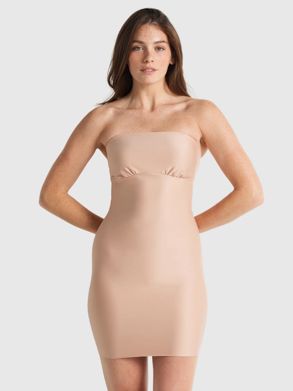 Beige strapless bodycon dress with a smooth form-fitting silhouette from the slip edit strapless slip collection