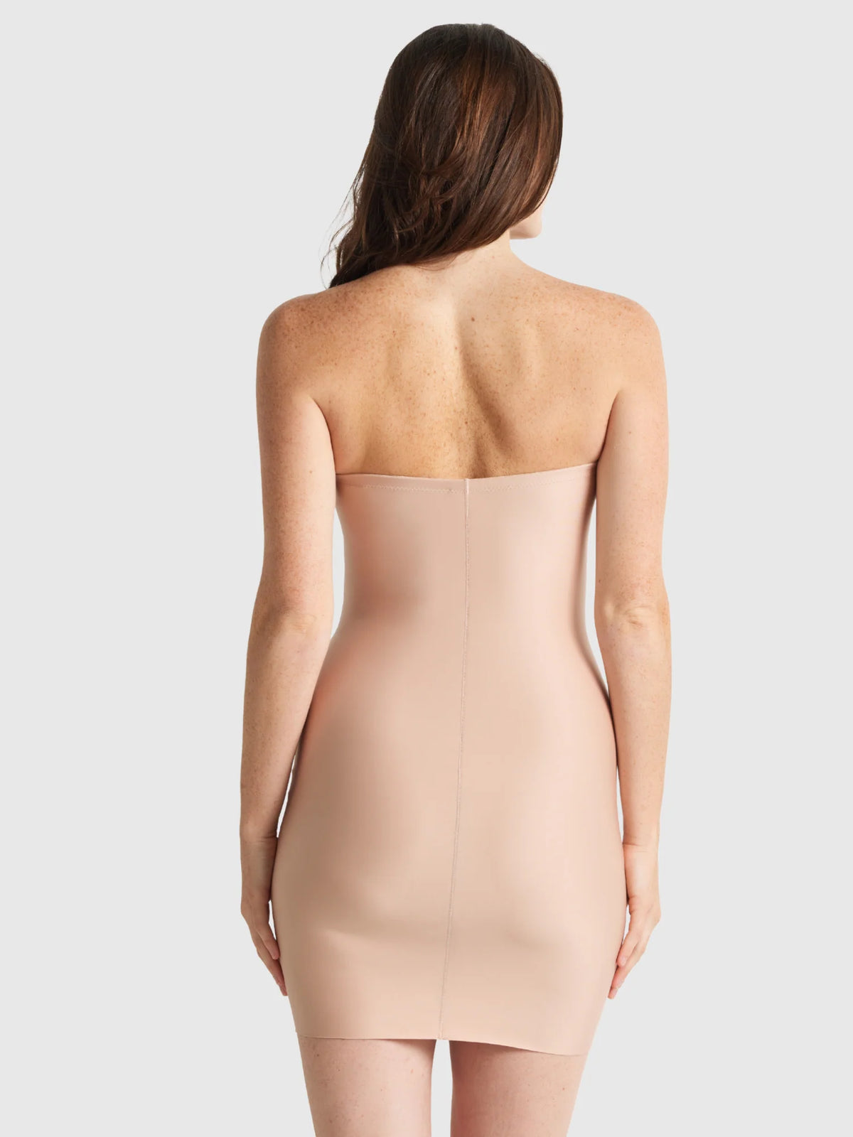 Beige strapless bodycon mini dress with a smooth form fitting silhouette from The Slip Edit strapless slip collection