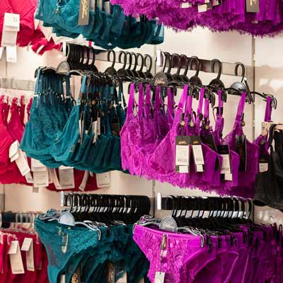 Bras and briefs hanging on wall