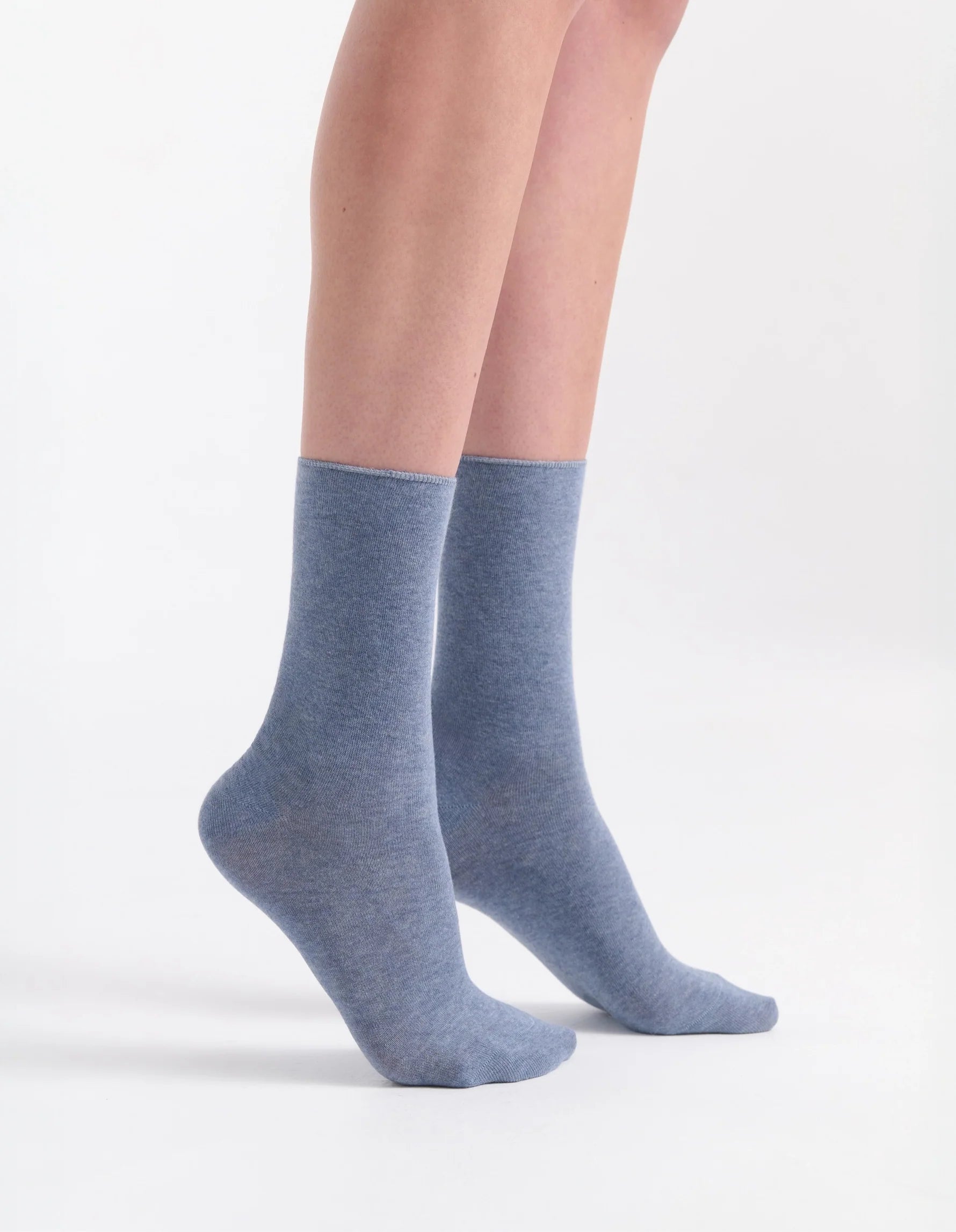 A pair of soft heathered blue ankle comfort top socks with a subtle textured knit pattern