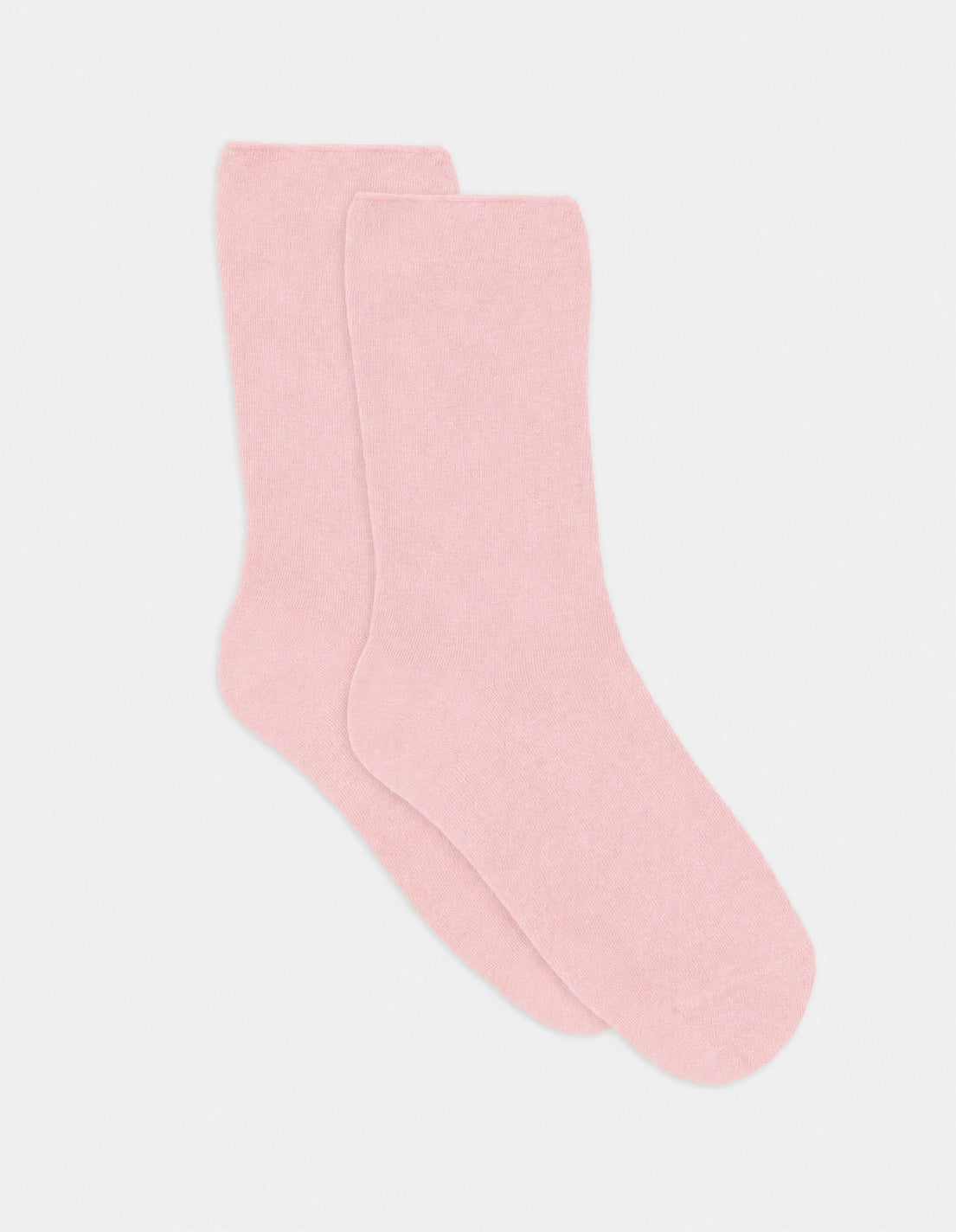 A pair of soft pink comfort top ankle socks with a smooth solid color and simple design
