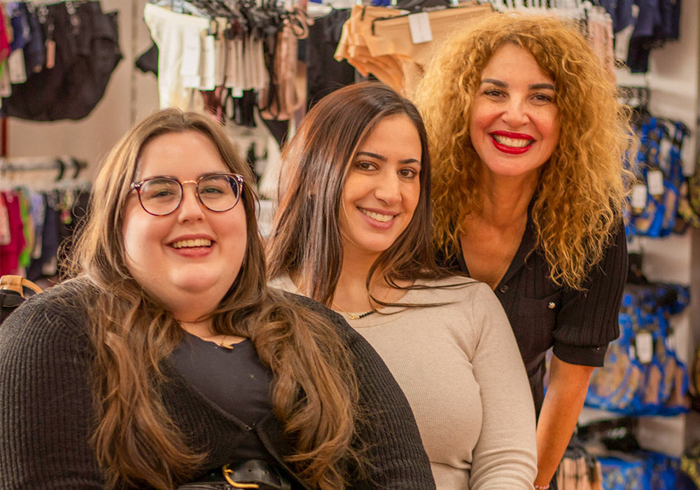 3 bra fitters smiling in a bra lingerie store