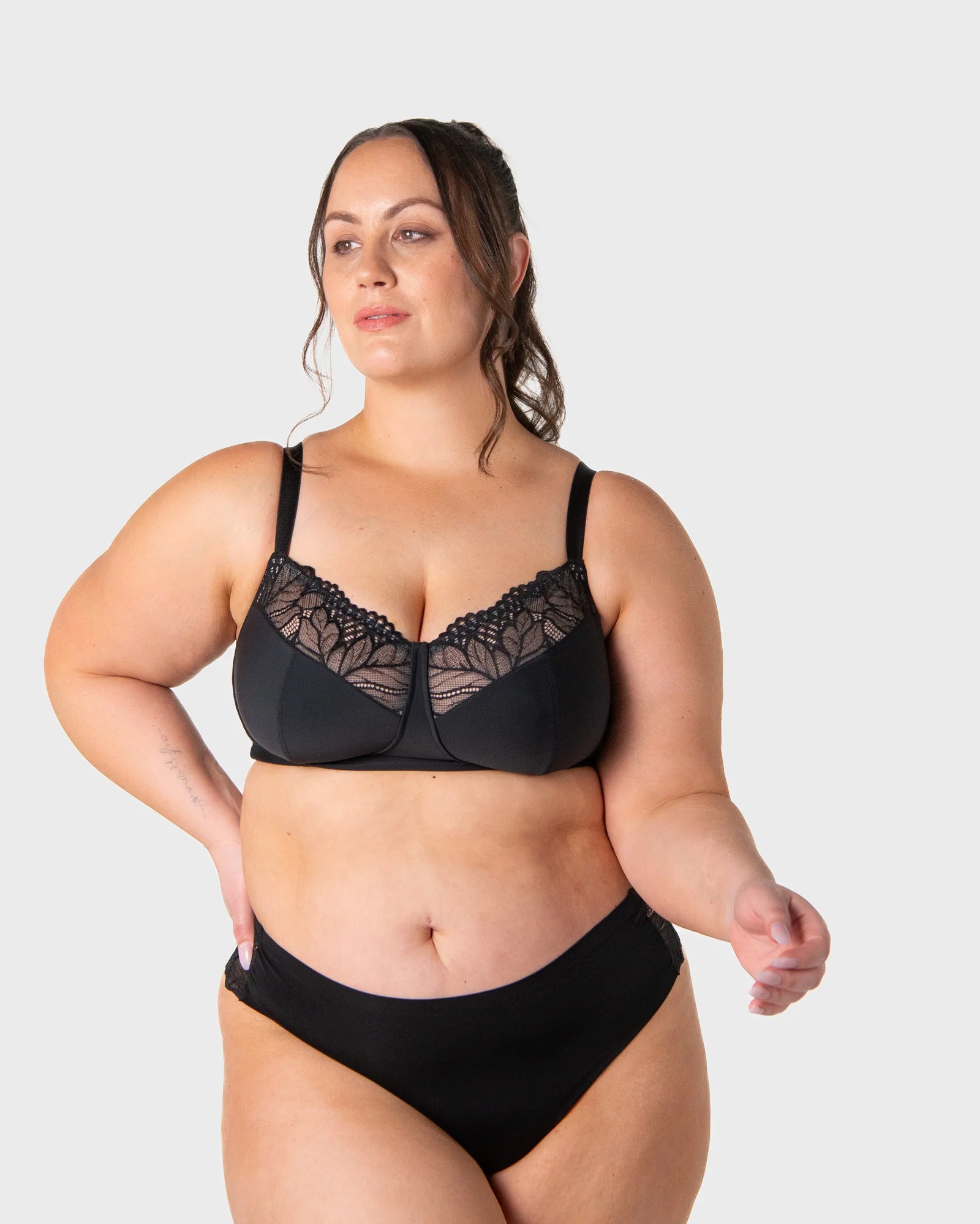 Black lace-trimmed luxe comfort wirefree bra with supportive cups and adjustable straps in black lace material