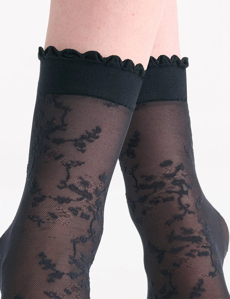 Black lace knee-high socks with scalloped elastic cuff featured in elanora floral anklets product image