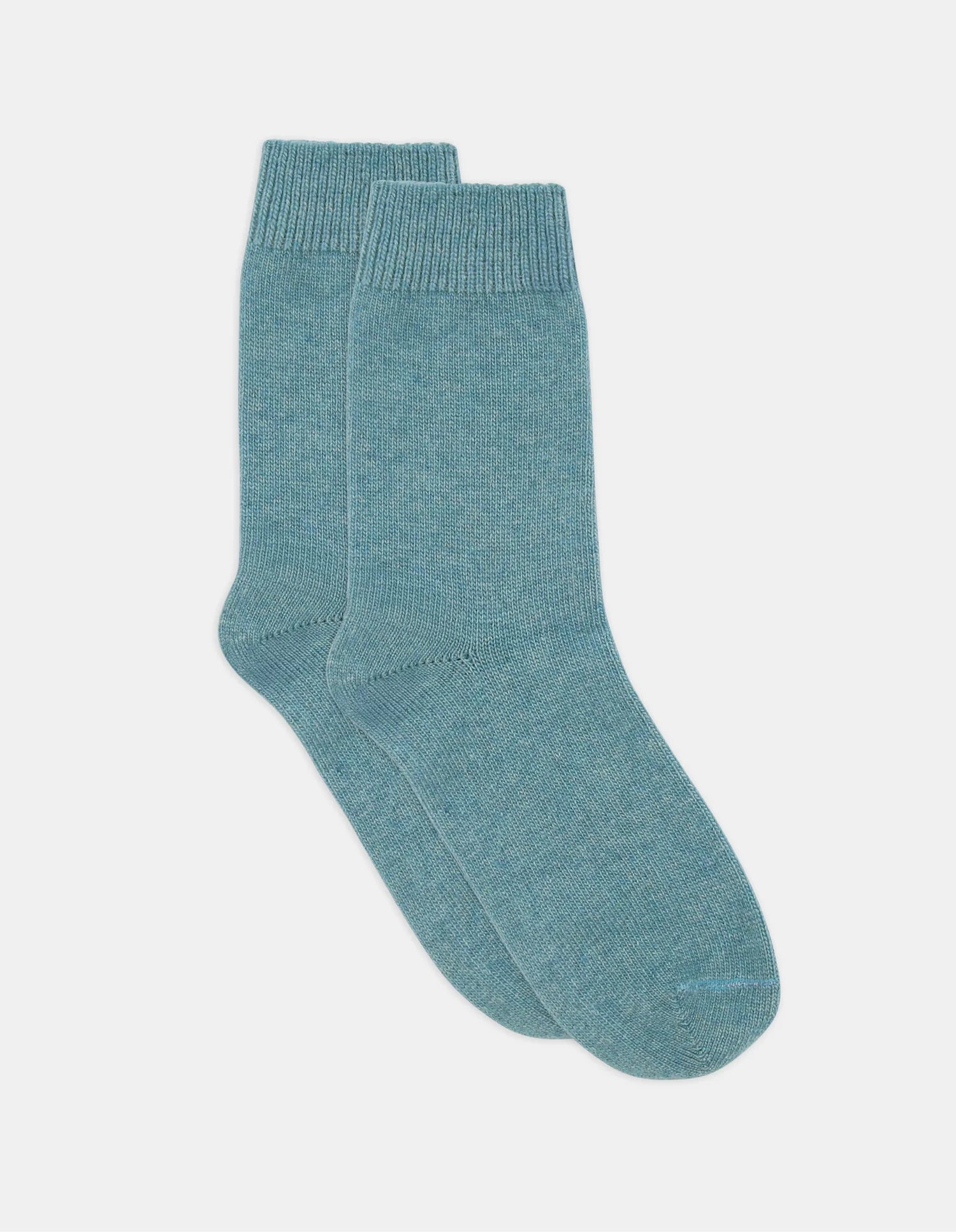 A pair of soft teal knit pina crew socks with ribbed cuffs and a simple design