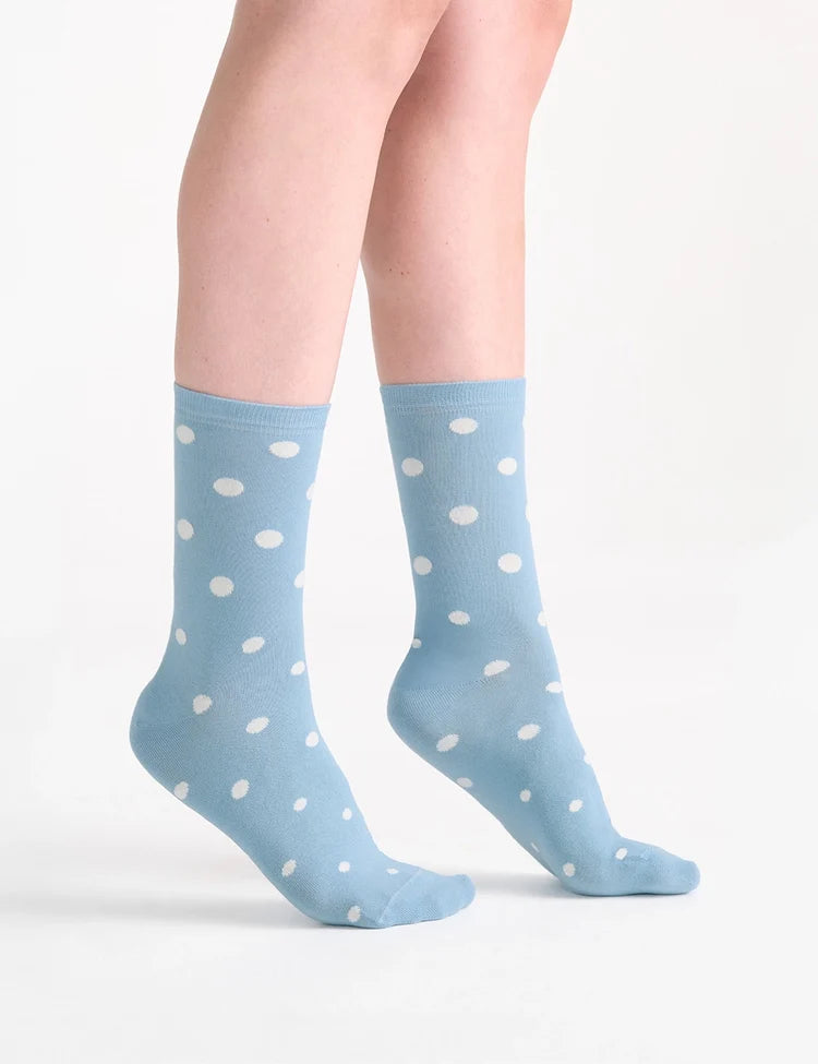 Light blue crew socks with white polka dots featuring a soft cotton blend for comfortable everyday wear