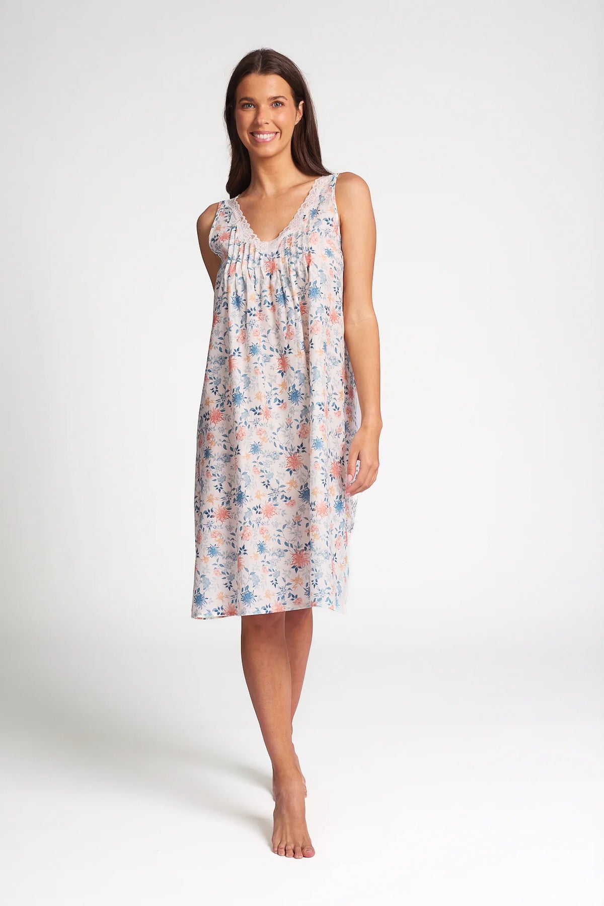 A soft sleeveless cotton silk nightie in light pastel with delicate pink and blue floral patterns for comfortable sleep