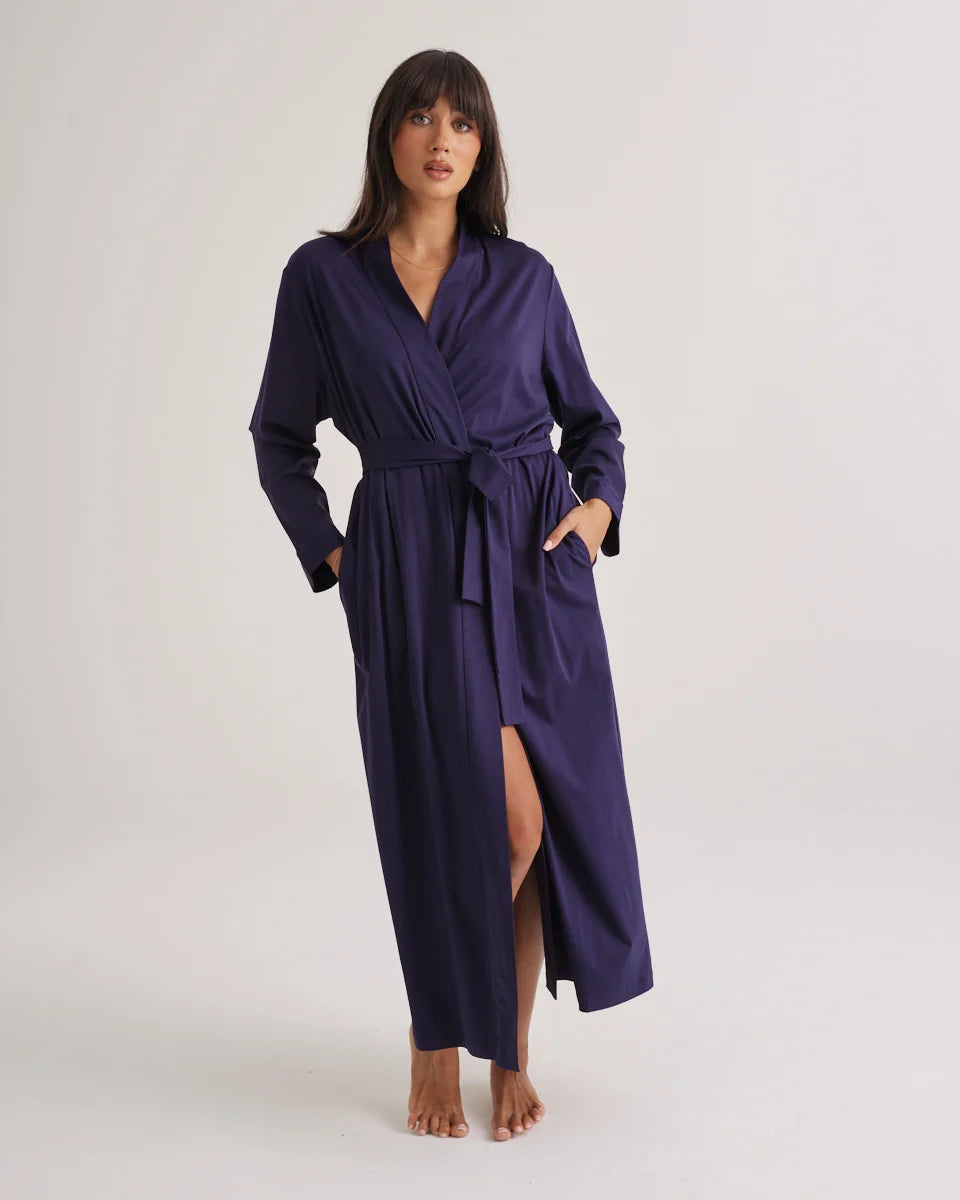 A navy blue supima cotton robe with satin finish wrap-style front belted waist and side slit