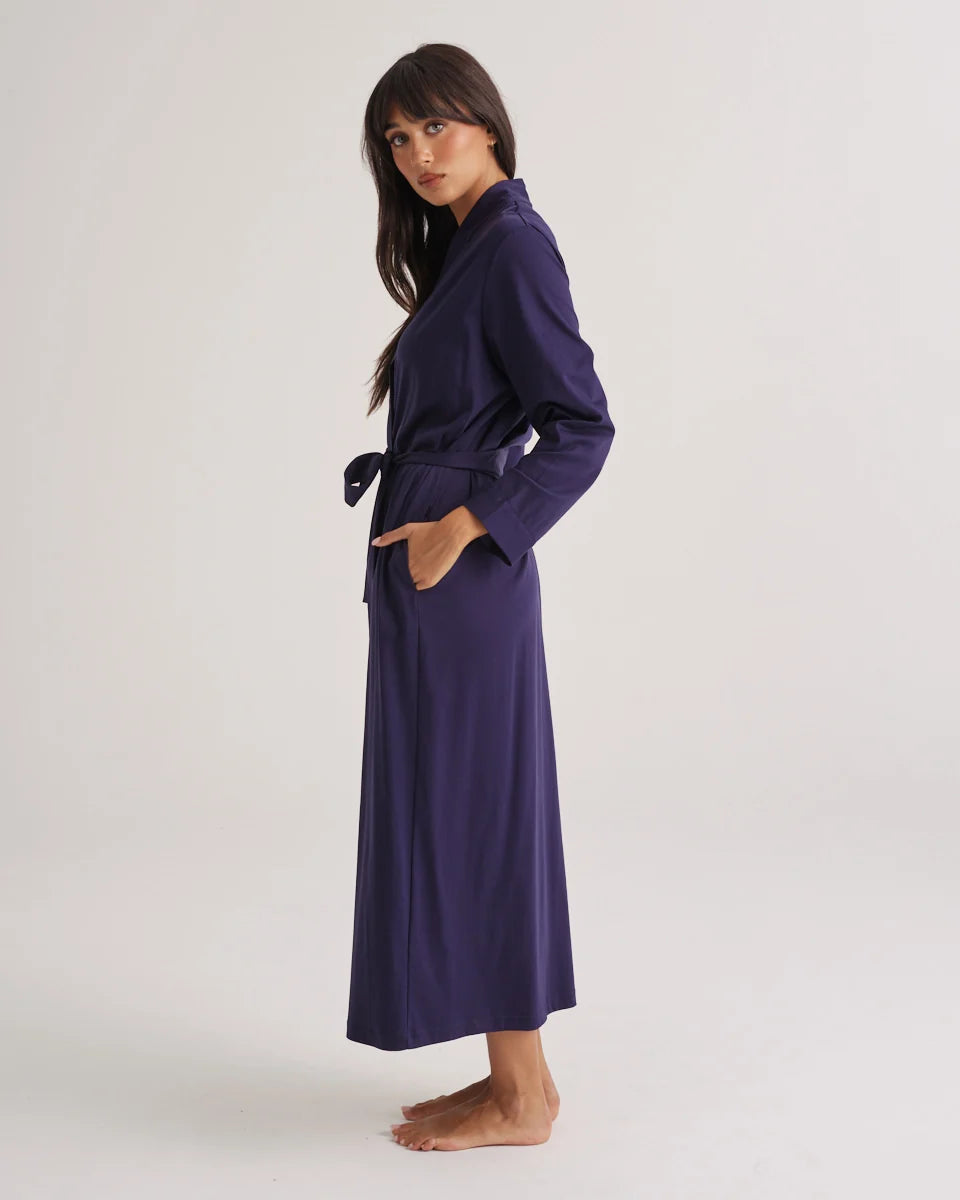 A navy blue supima cotton robe with long sleeves and a belted waist for comfortable loungewear