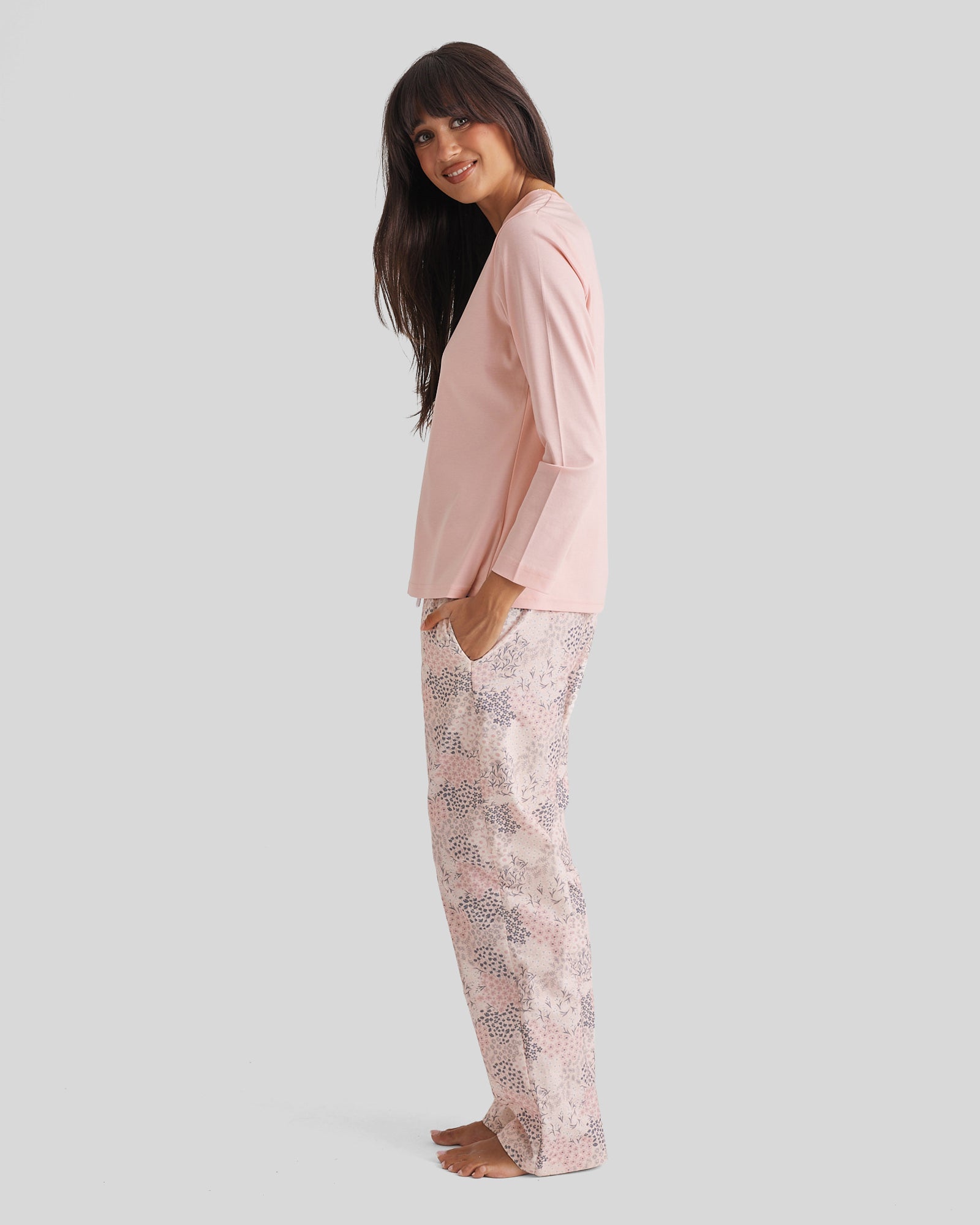 Woman in soft pink long-sleeved top and floral pajama pants, Cotton Pyjama Set