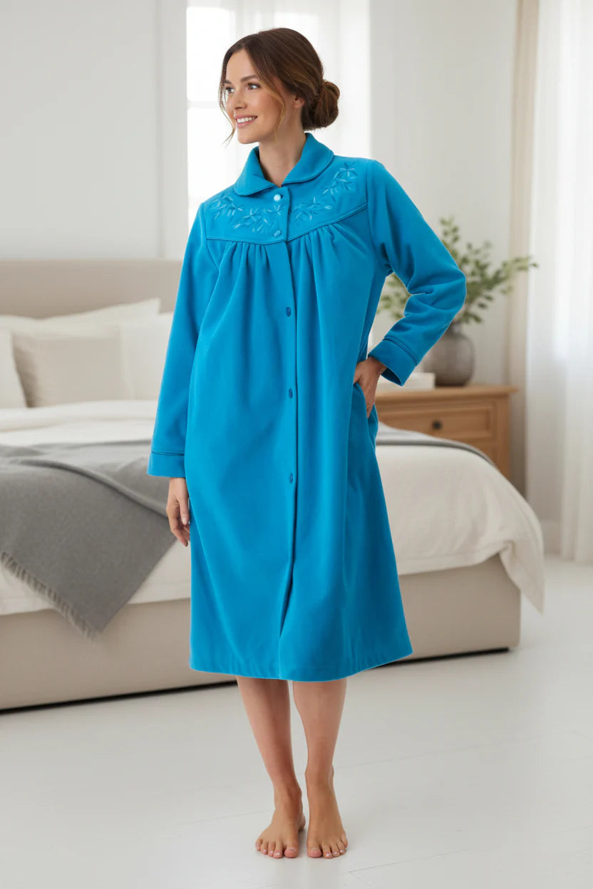 A vibrant blue short button gown nightgown with long sleeves and delicate floral embroidery on the collar