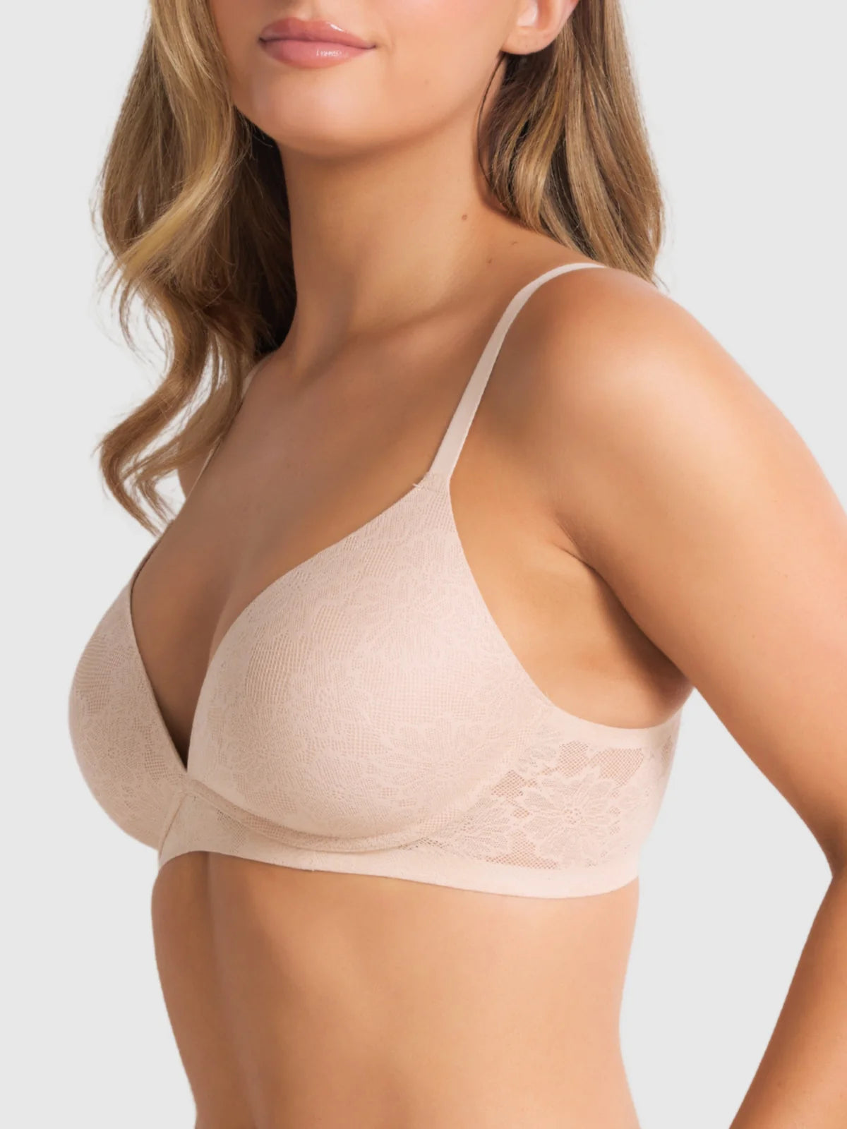 Beige underwire plunge bra with lace trim and adjustable straps