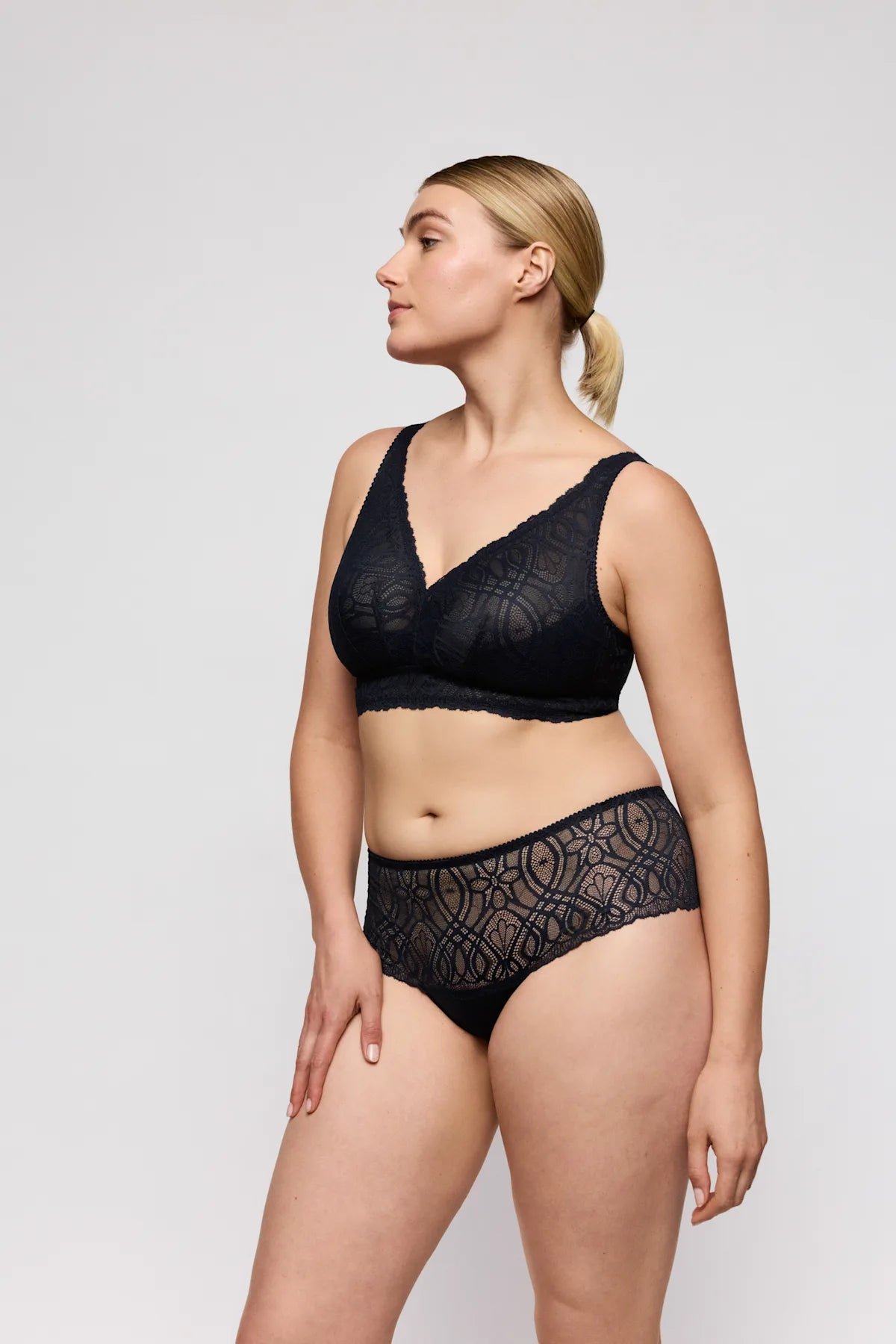 Black lace Salerno full cup bra and high-waisted panties with intricate floral patterns in matching lingerie set
