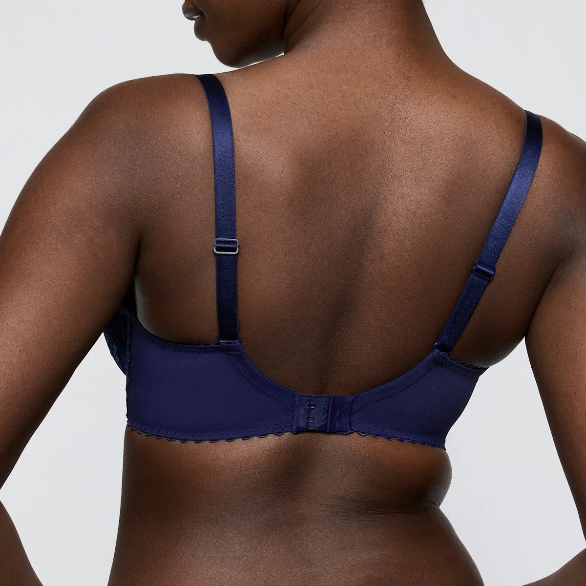 Navy blue satin san angel plunge bra with scalloped edge and adjustable straps for comfortable support
