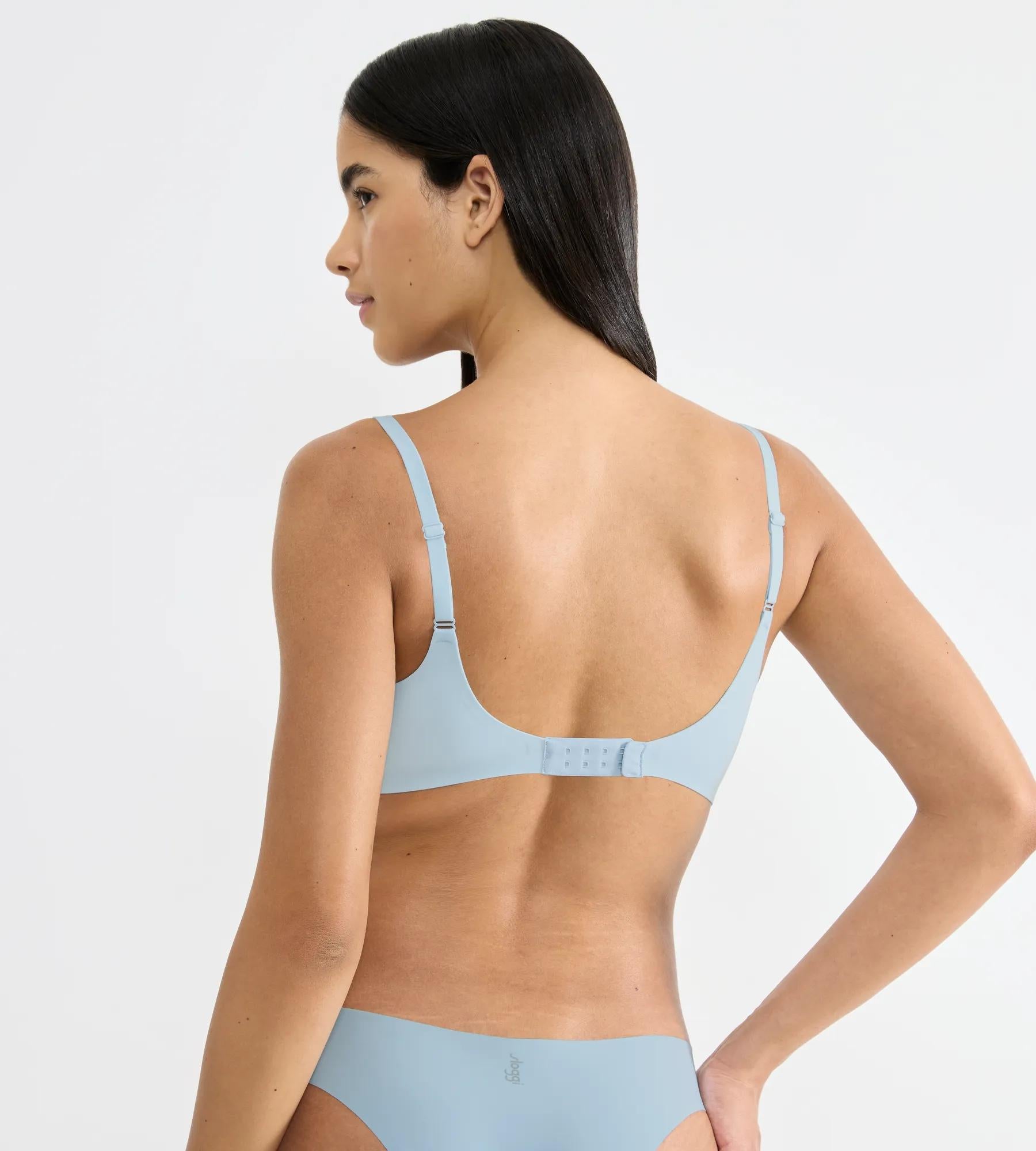 Light blue seamless the up bra with adjustable straps and back closure band shown from the back side