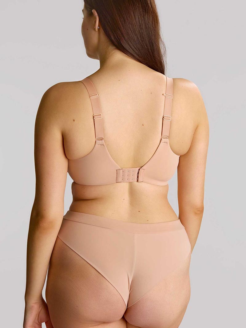 Beige seamless muse plunge bra with adjustable straps and a central back closure shown from the back side